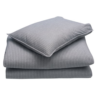Bild på påslakanset Kiel, tillverkat av 99% återvunnet material. Sobra färger, 80% återvunnen bomull och 20% återvunnen polyester. Passar enkelsängar i storleken 150x210cm.