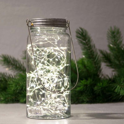 LED-ljusslinga i glasburk som lyser upp med varmvitt sken. 20 varmvita led, 200 cm