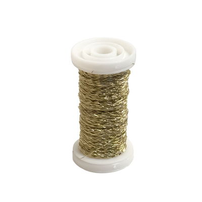Bouillontråd guldfärgad 0,3 mm 30 g Bouillontråd guldfärgad 0,3 mm 30 g på vit trådrulle för kransbinderi, dekoration och pyssel