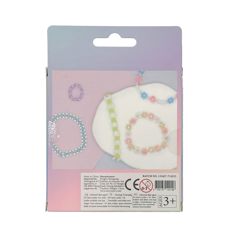 Baksida av glaspärlor pastellfärger svarta och vita färger 90 g med exempel på armband och halsband