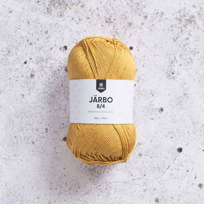 Järbo 8/4 50 gram. Guldgult bomullsgarn. 100% bomull.