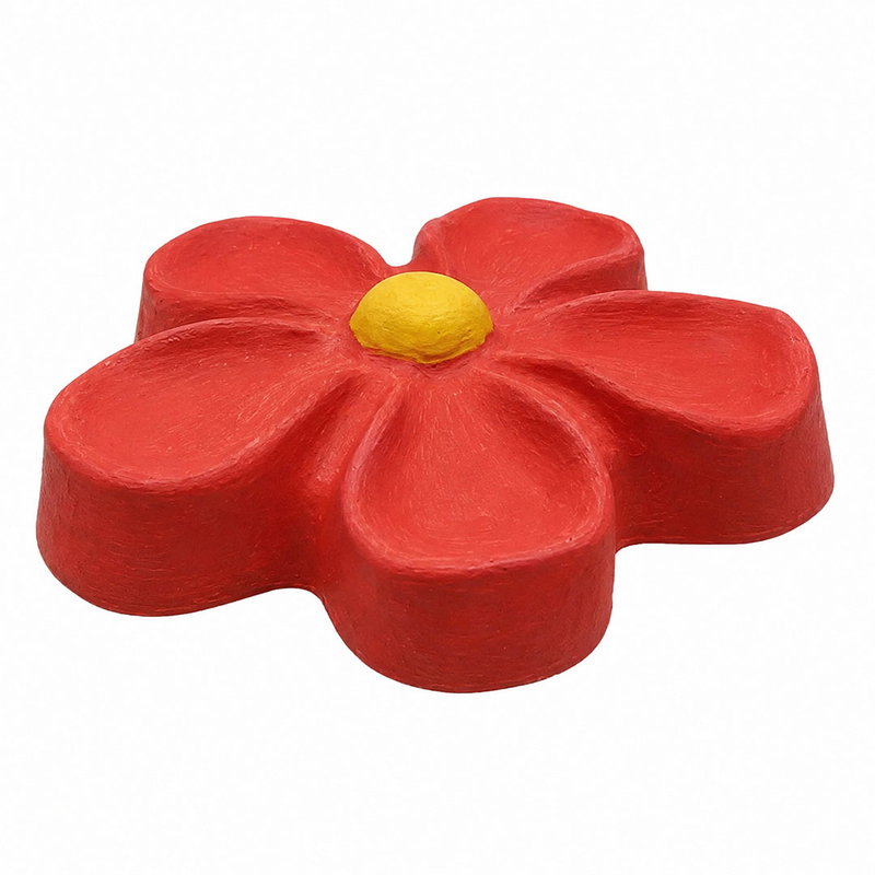 Blomma gjuten av gips och målad i rött och gult