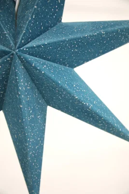 Blå julstjärna i sammet med glitter