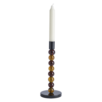 Brun ljusstake i glas
