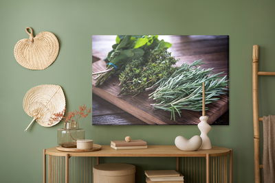Ljuddämpande tavla - Bundles of herbs on a wooden
