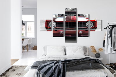 Ljuddämpande tavla - A red muscle car in a garage