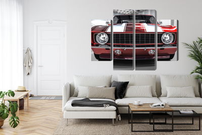 Ljuddämpande tavla - A red muscle car in a garage