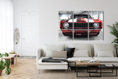 Ljuddämpande tavla - A red muscle car in a garage