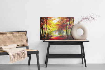 Ljuddämpande tavla - A forest landscape in autumn