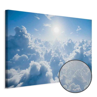 Schuin productaanzicht van Heavenly calm warm rays of. Het motief loopt door over de randen van het canvas. Een ronde detailopname toont het reliëf van het geloppervlak.