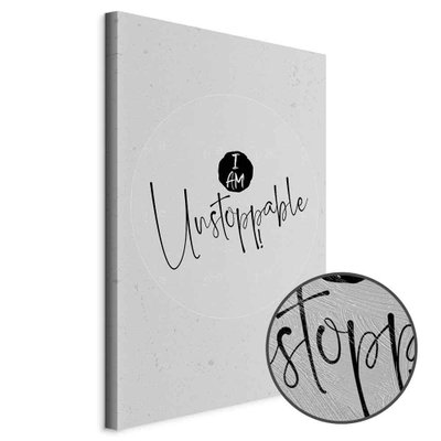 Schuin productaanzicht van I am unstoppable. Het motief loopt door over de randen van het canvas. Een ronde detailopname toont het reliëf van het geloppervlak.