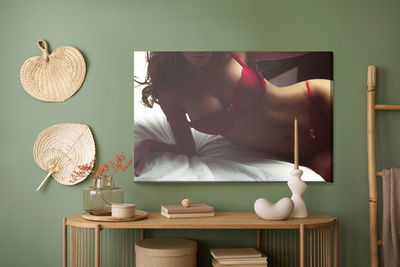 Ljuddämpande tavla - Woman in lingerie on the bed