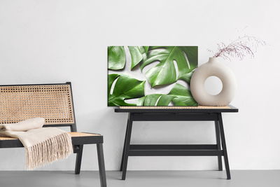 Ljuddämpande tavla - Monstera leaves on a gray