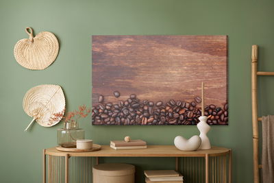 Ljuddämpande tavla - Coffee beans on a wood