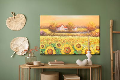 Ljuddämpande tavla - Cottages at a sunflower field