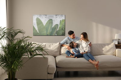 Ljuddämpande tavla - Tropical leaves on concrete