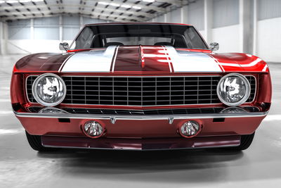 Ljuddämpande tavla - A red muscle car in a garage