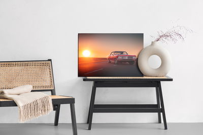 Ljuddämpande tavla - Retro car and sunset
