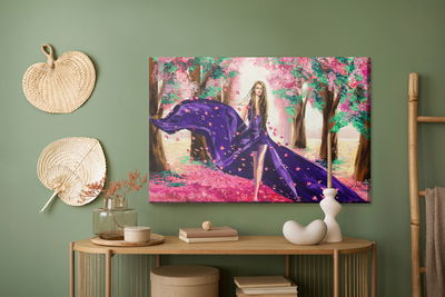 Ljuddämpande tavla - A woman among spring flowers