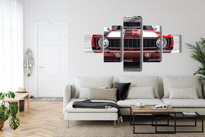 Ljuddämpande tavla - A red muscle car in a garage