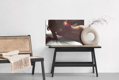 Ljuddämpande tavla - Woman in lingerie on the bed