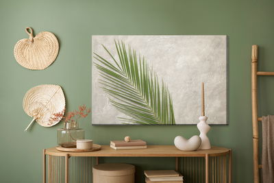 Ljuddämpande tavla - Palm leaf on a concrete