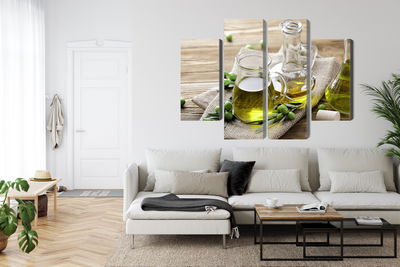 Ljuddämpande tavla - Olive oil with green olives