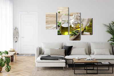 Ljuddämpande tavla - Olive oil with green olives