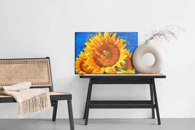 Ljuddämpande tavla - Painted sunflowers on a blue