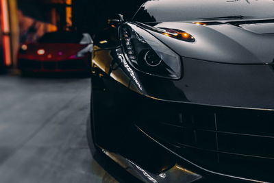 Ljuddämpande tavla - Front of a black sports car