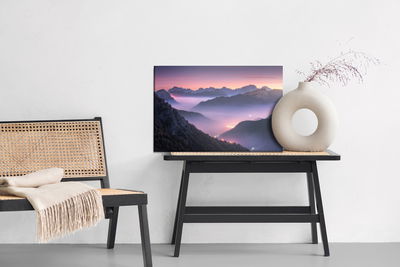 Ljuddämpande tavla - Mountains in fog at evening