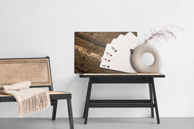 Ljuddämpande tavla - Aces on a wooden table