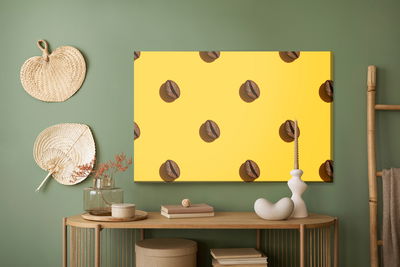Ljuddämpande tavla - Coffee beans on a yellow