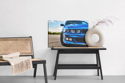 Ljuddämpande tavla - Sporty blue car and nature