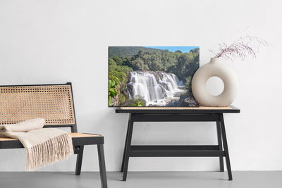 Ljuddämpande tavla - A waterfall among lush