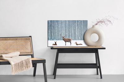 Ljuddämpande tavla - Deer and does in a winter