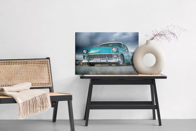 Ljuddämpande tavla - Turquoise car and clouds