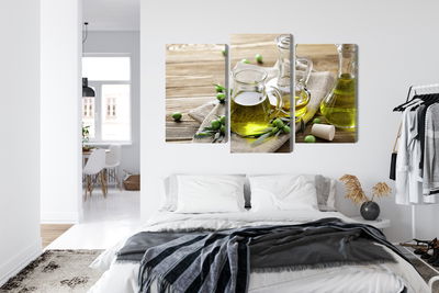 Ljuddämpande tavla - Olive oil with green olives
