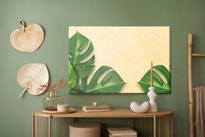 Ljuddämpande tavla - Monstera leaves on a beige