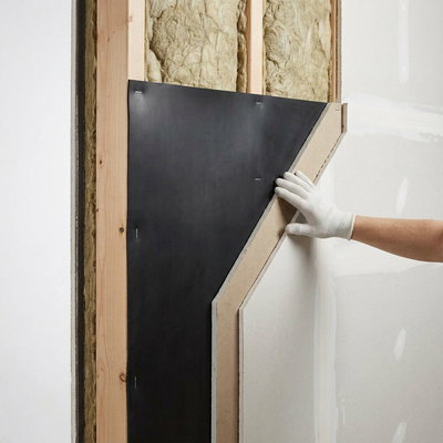 SilentDirect MLV is installed behind wall panels in a wood-frame structure for better sound insulation