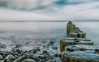 Ljuddämpande tavla - Rocky beach and 3d wooden