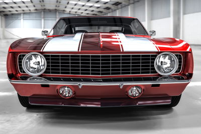 Ljuddämpande tavla - A red muscle car in a garage