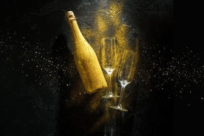 Ljuddämpande tavla - Golden bottle of champagne