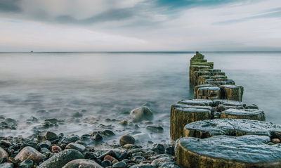 Ljuddämpande tavla - Rocky beach and 3d wooden