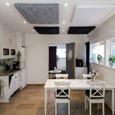SilentDirect PES Ceiling black ceiling absorbers installed above the kitchen island for improved acoustics and reduced echo