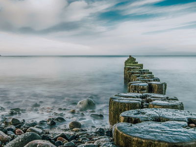 Ljuddämpande tavla - Rocky beach and 3d wooden