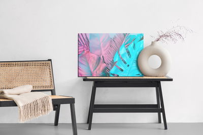 Ljuddämpande tavla - Tropical leaves in neon