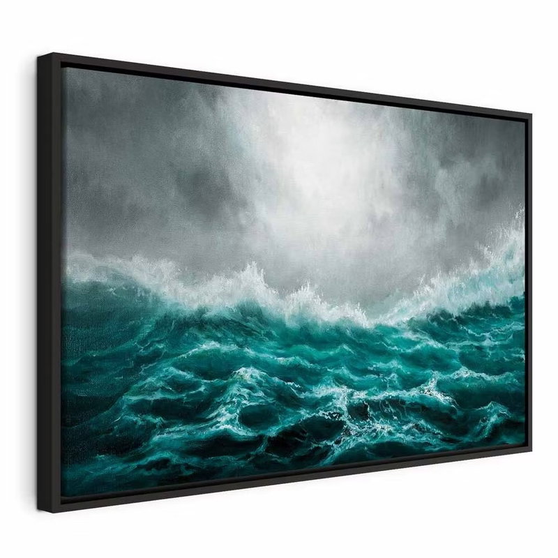 Restless ocean wide – svart ram. Höga turkosa vågor och vitt skum breder ut sig under en mörk, grå molnhimmel.