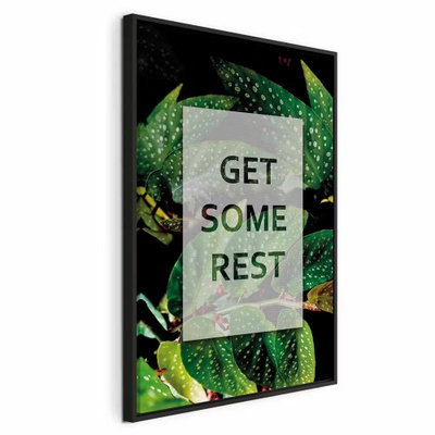 Get some rest vertical – svart ram. Texten GET SOME REST står på ett ljust mittfält omgivet av daggprydda gröna blad.