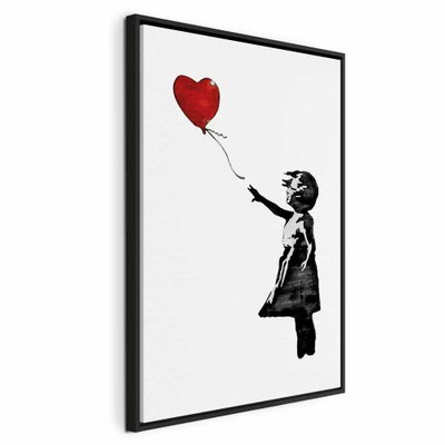Banksy girl with balloon – svart ram. En liten svart flicksilhuett sträcker armen mot en röd hjärtformad ballong på vit botten.